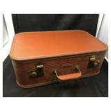 Small vintage Lady Baltimore suitcase.