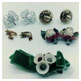 4 pairs of clip on earrings and a hair pin