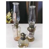 2 10" tall oil lamps and a 4" tall oil lmap