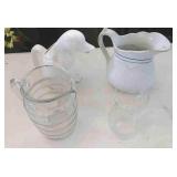 2 glass pitchers a ceramic duck pitcher and a