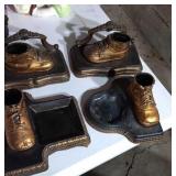 4 bronzed baby shoe displays. 2 are bookends.