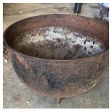 Large cast-iron kettle with three legs, has a