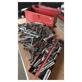 Metal toolbox full of wrenches sockets and