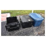 4 huge plastic totes. One of the black ones is