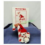 Dept 56 Billy Buttons Billy next to a candy cane
