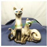 Porcelain Siamese cats with blue painted eyes