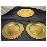 Six Gold Colored Plastic Chargers