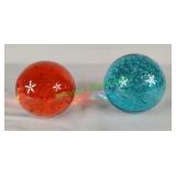 Glass paperweights with controlled bubbles