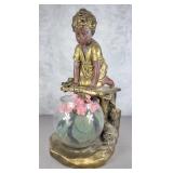 Plaster statue with fish bowl