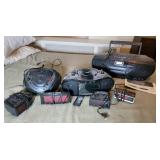 Three Boom Boxes and four alarm clocks