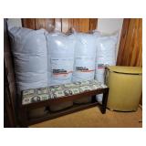 Bench, vintage hamper and four body pillows