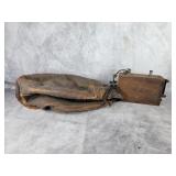 Vintage leather punching bag and wood Ford battery