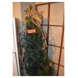 Lighted tree in pot.