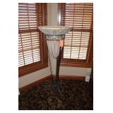 Large urn in metal stand. 54" tall