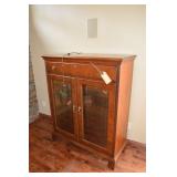 2 door Hekman lighted cabinet with single door.