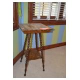 Table with turned legs. Top has damage.