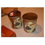 Lincoln logs in tins. One is full, one is empty