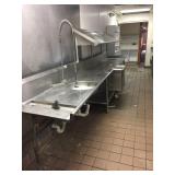 Dishwasher intake station with upper slanted