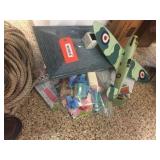 Plastic airplane (damaged), tin doll house & furn