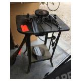 Motor, metal brush wheel on stand