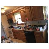 Contents of kitchen cupboards. One side.