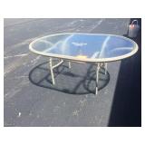 Outdoor glass top patio table