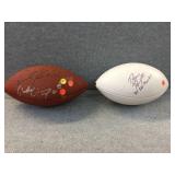 2 footballs signed by Paup & others