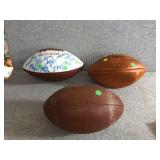 3 footballs with assorted signatures