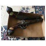 Gun wall decorators. Damaged hammer.