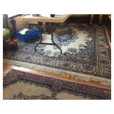 132" x 99" area rug. Fringe is damaged.
