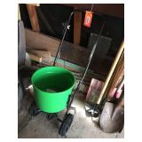 Walk behind fertilizer spreader.