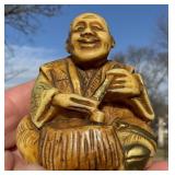 NETSUKE - SITTING MAN TRADITIONAL DRESS TREE STUMP