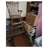 High chair, suitcase, coffee table and books