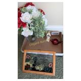 Fake flowers, frame, and candle