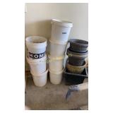 Buckets of landscaping stones and planters