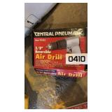 Central pneumatic reversible air drill