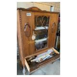 Wood cabinet with contents in drawer