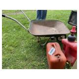 Gas cans and wheelbarrow