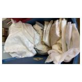 Tote of tablecloths and misc.