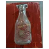 J. Spuhler Dairy milk bottle one quart