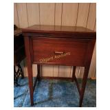 Sewing machine cabinet