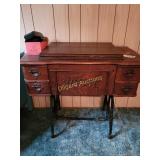 White sewing machines & cabinet w/attachments