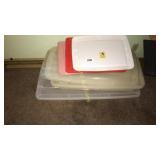 Four plastic storage containers and lids
