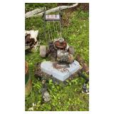 Oil cans, barrels, wheelbarrow, mower