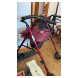 Rolling walker with seat and brakes