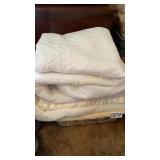 Laundry basket of blankets