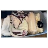 Tote of blankets and sheets