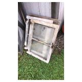 Old windows with glass still inside them