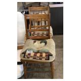 Two wooden chairs with woven seats and rooster