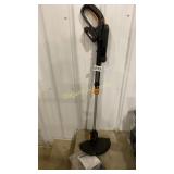 Cordless Worx trimmer with battery charger